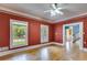 Bright living room with hardwood floors, large windows, and decorative crown molding at 3348 Summit Turf Ln, Snellville, GA 30078