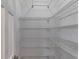 Spacious pantry with multiple rows of white wire shelving to maximize storage and organization at 3348 Summit Turf Ln, Snellville, GA 30078