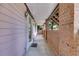 Covered porch with brick columns and a welcoming entrance mat at 3348 Summit Turf Ln, Snellville, GA 30078