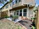 Outdoor patio area with a dining table surrounded by green landscaping at 3534 Clancy Way, Smyrna, GA 30080