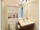 Functional bathroom featuring a toilet, vanity with sink and a storage cabinet for toiletries at 3534 Clancy Way, Smyrna, GA 30080