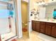Well-lit bathroom with double vanity, walk-in shower, and adjacent toilet at 3534 Clancy Way, Smyrna, GA 30080