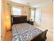 Inviting bedroom featuring a bed, a bedside table, and ample natural light, ideal for relaxing at 3534 Clancy Way, Smyrna, GA 30080
