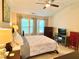 Cozy bedroom featuring a ceiling fan, natural light, and neutral decor at 3534 Clancy Way, Smyrna, GA 30080