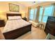 Bedroom with large windows, carpeted floor, a ceiling fan and neutral colors at 3534 Clancy Way, Smyrna, GA 30080