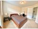 Well-lit bedroom featuring neutral walls, a comfortable bed, and a convenient workspace with a desk at 3534 Clancy Way, Smyrna, GA 30080