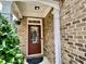 Welcoming front entry with a decorative door and a well-manicured shrub at 3534 Clancy Way, Smyrna, GA 30080