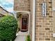 Cozy front porch with a stylish brown door, lush greenery, and the house number prominently displayed at 3534 Clancy Way, Smyrna, GA 30080