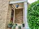 Inviting front porch with decorative plants and a hanging planter, creating a warm welcome at 3534 Clancy Way, Smyrna, GA 30080