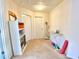 Hallway with storage shelves, multiple doors, and carpeted flooring providing access to different parts of the home at 3534 Clancy Way, Smyrna, GA 30080