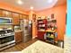 Bright kitchen offers stainless steel appliances, granite countertops, and wooden cabinets for storage at 3534 Clancy Way, Smyrna, GA 30080