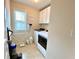 Clean laundry area with a window, shelving and modern washer and dryer at 3534 Clancy Way, Smyrna, GA 30080