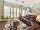 Inviting living room with natural light and a comfortable leather sofa at 3534 Clancy Way, Smyrna, GA 30080