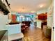 Bright living room showcasing an open floor plan with views of the dining area, kitchen, and staircase at 3534 Clancy Way, Smyrna, GA 30080