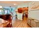 Open-concept living area with hardwood flooring, a dining table, and views into the kitchen at 3534 Clancy Way, Smyrna, GA 30080