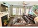 Cozy living room featuring a fireplace, built-in shelving, and large windows at 3534 Clancy Way, Smyrna, GA 30080