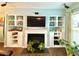 Living room featuring a fireplace with built-in shelving at 3534 Clancy Way, Smyrna, GA 30080
