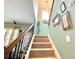 Staircase with carpet steps and modern railings leading to the upper floor at 3534 Clancy Way, Smyrna, GA 30080