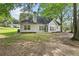 A well-maintained lawn with mature trees creates a serene backyard setting at 4042 Laurel Bend Ct, Snellville, GA 30039