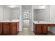 Bathroom featuring dual vanities and a view into the living room at 4042 Laurel Bend Ct, Snellville, GA 30039