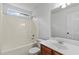 Clean bathroom with tub-shower combo, single vanity, and ample lighting at 4042 Laurel Bend Ct, Snellville, GA 30039