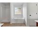 Bathroom featuring a soaking tub under a window and separate shower at 4042 Laurel Bend Ct, Snellville, GA 30039