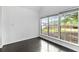 Bright room with large window overlooking yard and dark wood floors at 4042 Laurel Bend Ct, Snellville, GA 30039
