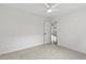 Neutral bedroom with plush carpet, ceiling fan, and ample natural light at 4042 Laurel Bend Ct, Snellville, GA 30039