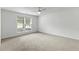 Spacious bedroom featuring large window and ceiling fan at 4042 Laurel Bend Ct, Snellville, GA 30039