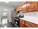 Updated kitchen featuring wooden cabinets, stainless appliances, and modern countertop at 4042 Laurel Bend Ct, Snellville, GA 30039