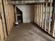 Unfinished basement with framed walls and concrete floor, presenting an opportunity for expansion at 410 S Gordon Sw Rd, Mableton, GA 30126