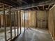 Unfinished basement featuring a concrete floor and exposed framing, providing space for future development at 410 S Gordon Sw Rd, Mableton, GA 30126