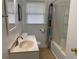 Clean bathroom featuring a shower-tub combination, neutral colored vanity, and tile flooring at 410 S Gordon Sw Rd, Mableton, GA 30126
