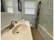 Clean bathroom featuring a shower-tub combination, neutral colored vanity, and tile flooring at 410 S Gordon Sw Rd, Mableton, GA 30126
