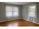 Bedroom with light gray walls and two large windows at 410 S Gordon Sw Rd, Mableton, GA 30126