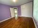 Bedroom with bright purple walls and view into another room at 410 S Gordon Sw Rd, Mableton, GA 30126