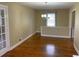 Hardwood floored dining area with natural light and an open layout at 410 S Gordon Sw Rd, Mableton, GA 30126