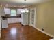 Spacious kitchen featuring white cabinets, hardwood floors, and an adjacent dining area at 410 S Gordon Sw Rd, Mableton, GA 30126