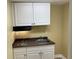Practical kitchenette featuring countertop, sink, and cabinets for storage at 410 S Gordon Sw Rd, Mableton, GA 30126