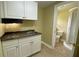 Well-organized kitchenette area with modern appliances and access to bathroom at 410 S Gordon Sw Rd, Mableton, GA 30126