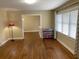 Bright living room featuring hardwood floors, ample space, and a large window at 410 S Gordon Sw Rd, Mableton, GA 30126