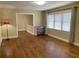 Bright living room featuring hardwood floors, ample space, and a large window at 410 S Gordon Sw Rd, Mableton, GA 30126