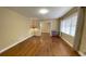 Bright living room featuring hardwood floors, ample space, and a large window at 410 S Gordon Sw Rd, Mableton, GA 30126