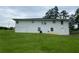 Spacious backyard featuring a well-maintained lawn and a white-painted home exterior at 410 S Gordon Sw Rd, Mableton, GA 30126