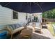 Inviting backyard patio with comfortable seating, perfect for relaxation and outdoor enjoyment at 10880 Windham Way, Alpharetta, GA 30022