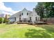 Expansive backyard featuring a deck, outdoor seating, and a well-maintained lawn at 10880 Windham Way, Alpharetta, GA 30022