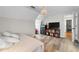 Bedroom with chandelier, hardwood floors, and lots of natural light at 10880 Windham Way, Alpharetta, GA 30022