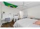 Bright bedroom with hardwood floors, comfortable bed, desk and lots of natural light at 10880 Windham Way, Alpharetta, GA 30022