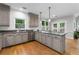 Bright kitchen with granite countertops, stainless steel appliances, and hardwood floors at 10880 Windham Way, Alpharetta, GA 30022