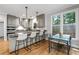 Well-appointed kitchen with granite countertops, stainless steel appliances, and breakfast bar at 10880 Windham Way, Alpharetta, GA 30022